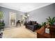 Cozy living room with natural light, comfortable seating, and stylish decor for relaxation at 3659 Coach Lantern Ave, Wake Forest, NC 27587