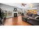 Spacious living room featuring a cozy fireplace and an open layout to the kitchen at 3659 Coach Lantern Ave, Wake Forest, NC 27587