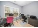 Bright office space featuring modern glass top desks, neutral walls, and ample natural light at 3659 Coach Lantern Ave, Wake Forest, NC 27587