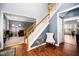 Inviting staircase with wood railings, leading to upper levels, complemented by stylish decor at 3659 Coach Lantern Ave, Wake Forest, NC 27587
