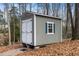 A nice-looking shed with double doors and one window at 3659 Coach Lantern Ave, Wake Forest, NC 27587
