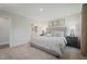Stylized bedroom with soft gray walls, plush carpet, and an en-suite bathroom at 14 Artesa Ct, Fuquay Varina, NC 27526