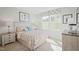 Cozy bedroom with golf-themed decor, bedside tables, and an airy window at 14 Artesa Ct, Fuquay Varina, NC 27526