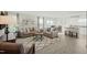 Spacious living room with plush sofas, patterned rug, and ample natural light at 14 Artesa Ct, Fuquay Varina, NC 27526
