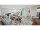 Open concept living room and kitchen with modern furnishings and neutral colors at 14 Artesa Ct, Fuquay Varina, NC 27526