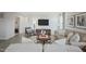 Cozy living room with a TV, comfortable seating, and a decorative rug at 14 Artesa Ct, Fuquay Varina, NC 27526