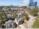 An aerial view of homes in a neighborhood with a skyline backdrop at 3727 Bellevue Rd, Raleigh, NC 27609