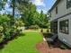 Spacious backyard with lush green lawn, mature trees, and landscaping at 3727 Bellevue Rd, Raleigh, NC 27609