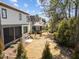 Expansive backyard with an enclosed porch, offering a serene outdoor living space at 3727 Bellevue Rd, Raleigh, NC 27609