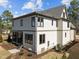 Rear exterior view of a two story home with a screened in porch and landscaped yard at 3727 Bellevue Rd, Raleigh, NC 27609