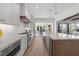 Spacious gourmet kitchen with stainless steel appliances, stone countertops, and hardwood flooring at 3727 Bellevue Rd, Raleigh, NC 27609