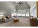 Inviting living room with plush seating, ceiling fan, and lots of natural light at 3727 Bellevue Rd, Raleigh, NC 27609