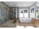 Modern bathroom featuring a soaking tub, separate glass shower, and serene natural light at 3727 Bellevue Rd, Raleigh, NC 27609