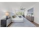 A luxurious main bedroom suite with an ensuite bathroom, large windows, and a ceiling fan at 3727 Bellevue Rd, Raleigh, NC 27609