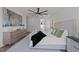 A luxurious main bedroom suite with an ensuite bathroom, large windows, and a ceiling fan at 3727 Bellevue Rd, Raleigh, NC 27609