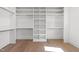 Spacious walk-in closet with custom shelving and wood flooring at 3727 Bellevue Rd, Raleigh, NC 27609