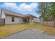 Expansive backyard with a covered patio and string lights at 38 Parkside Dr, Lillington, NC 27546