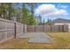 Fenced backyard features a gravel area, perfect for outdoor activities at 38 Parkside Dr, Lillington, NC 27546