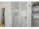 Bathroom with a glass-enclosed shower and built-in shelving for towels at 38 Parkside Dr, Lillington, NC 27546