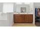 Bathroom with a double sink vanity, large mirror, and a walk-in closet at 38 Parkside Dr, Lillington, NC 27546