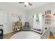 Well-lit Bedroom with hardwood floors and a decorative ceiling fan at 38 Parkside Dr, Lillington, NC 27546