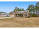 Inviting single-story home with solar panels, a two-car garage, and a well-kept lawn at 38 Parkside Dr, Lillington, NC 27546
