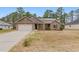 Charming single-story home with a brick facade, two-car garage, and well-maintained lawn at 38 Parkside Dr, Lillington, NC 27546