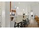 Open kitchen with a breakfast bar, granite countertops, pendant lighting, and stainless steel appliances at 38 Parkside Dr, Lillington, NC 27546