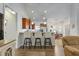 Open kitchen with stainless appliances, granite countertops, breakfast bar and pendant lighting at 38 Parkside Dr, Lillington, NC 27546