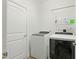 Clean laundry room with modern, front-load washer and dryer at 38 Parkside Dr, Lillington, NC 27546