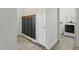 Convenient mud room with coat rack and storage, leading to the laundry area at 38 Parkside Dr, Lillington, NC 27546