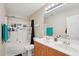 Bathroom featuring dual sinks with plenty of counter space and tub with shower at 3809 Volkswalk Pl, Raleigh, NC 27610