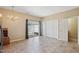 Bright dining area with tile flooring, a chandelier, and sliding door access to the backyard at 3809 Volkswalk Pl, Raleigh, NC 27610