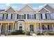 Charming townhouse featuring a cozy front porch, neat landscaping, and a welcoming entrance at 3809 Volkswalk Pl, Raleigh, NC 27610