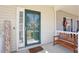 Close-up of a cheerful front porch, complete with a 'Welcome' sign and a quaint wooden bench at 3809 Volkswalk Pl, Raleigh, NC 27610