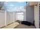 Private outdoor patio area enclosed with a white fence and offering space for gardening at 3809 Volkswalk Pl, Raleigh, NC 27610