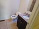 Functional half bathroom with granite vanity, tiled floors, and a standard toilet at 412 Nc-82, Dunn, NC 28334