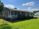 Charming single-story home featuring a welcoming front porch and well-maintained lawn at 412 Nc-82, Dunn, NC 28334