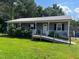 Charming single-story home with a welcoming porch, front yard, and convenient ramp at 412 Nc-82, Dunn, NC 28334