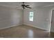 Bright, spacious living room featuring tiled floors, a ceiling fan, and natural light at 412 Nc-82, Dunn, NC 28334