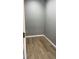 Walk-in closet with wood-look flooring at 471 Merriman St, Henderson, NC 27536