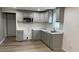 This kitchen features modern gray cabinets, stainless steel appliances, and white countertops at 471 Merriman St, Henderson, NC 27536