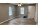 Bright living room featuring luxury vinyl plank flooring, neutral paint, and ample natural light at 471 Merriman St, Henderson, NC 27536