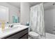 Bathroom featuring a shower and tub combination and a stylish sink with a white countertop at 5818 Humanity Ln, Raleigh, NC 27616