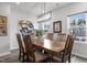 The dining area is bright and offers comfortable seating for six and lots of wall decor at 5818 Humanity Ln, Raleigh, NC 27616