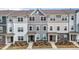 Attractive townhome exteriors showcasing coordinated color palettes and inviting front entryways at 5818 Humanity Ln, Raleigh, NC 27616