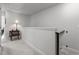 Bright hallway with neutral carpet, a decorative table, and natural light at 5818 Humanity Ln, Raleigh, NC 27616