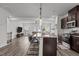 Open-concept kitchen with granite countertops, stainless steel appliances, and a view to the living room at 5818 Humanity Ln, Raleigh, NC 27616