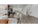 The home features an open-concept design with modern floors connecting the kitchen and living spaces at 5818 Humanity Ln, Raleigh, NC 27616