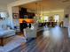 Open concept from the kitchen and living room, to the dining room featuring modern flooring at 5818 Humanity Ln, Raleigh, NC 27616